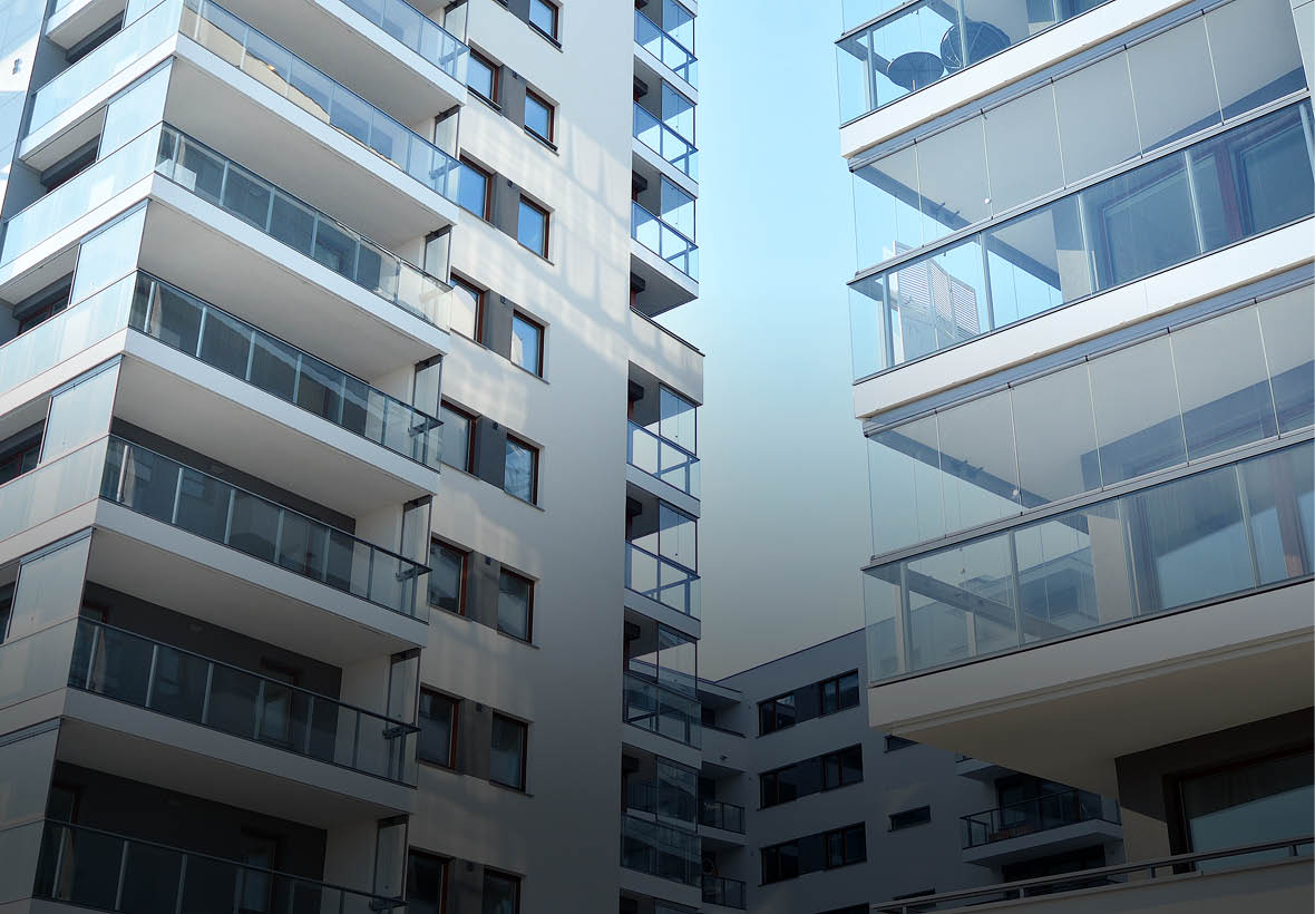 Condominium and apartment building with  symmetrical modern architecture in the city downtown 